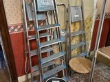 a ladder that is leaning against a wall in a room