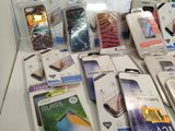 a lot of cell phones that are sitting on a table