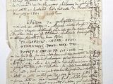 a piece of paper with writing on it sitting on top of a table