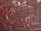 a picture of a wooden carving of a horse and a man