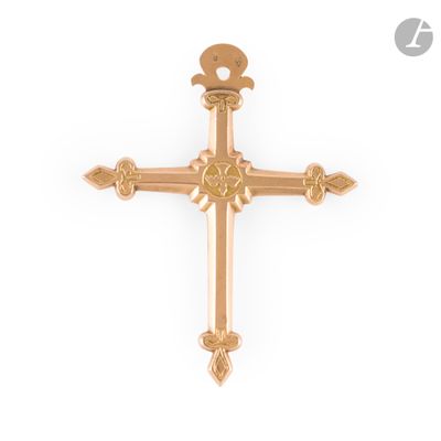 a gold cross on a white background with a crescent above it