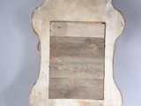 an old wooden mirror with a wooden frame on a white background