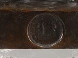 a bronze statue of a man on a horse on a pedestal