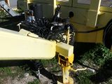 a yellow trailer with a yellow trailer attached to it