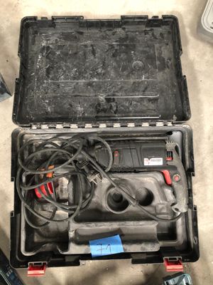 a tool case with tools inside of it on the floor