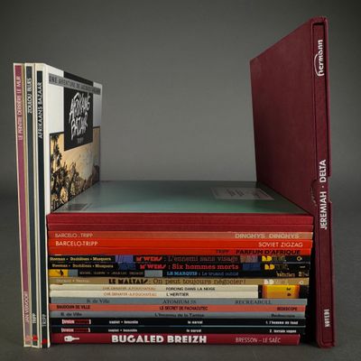 many books stacked on top of each other on a table