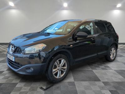 a picture of a black nissan rav parked in a garage