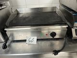 an electric griddle on the counter in the kitchen