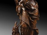 une image représentant une statue en bronze d'une femme accompagnée d'un chien