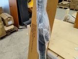 a cardboard box with a dress on it in a warehouse
