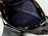 an image of a black purse with flowers on it