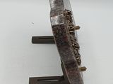 a sculpture of a piece of wood on a stand