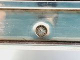 a close up view of a metal drawer with a knob