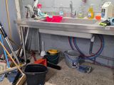 a picture of a kitchen with a sink and a lot of tools