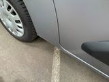 a close up of a car ' s side door with a sticker on it