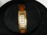 an image of a watch in a case on a table