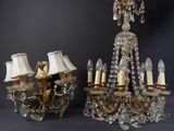 two chandeliers with lamps and lampshads on a table