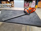 a chainsaw sitting on top of a table in a store