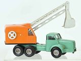 a toy truck with a crane on the back of it