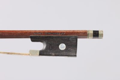 a close up of a violin bow with a string attached to it