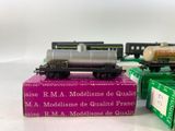 three model trains sitting on top of each other on a table