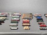 a lot of toy trains that are on a table