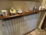 a picture of a radiator with cups on top of it