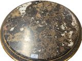 a marble top table with a metal base
