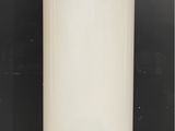 a large white water heater sitting on top of a tiled floor