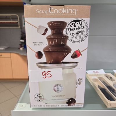 a chocolate fountain that is on display in the store