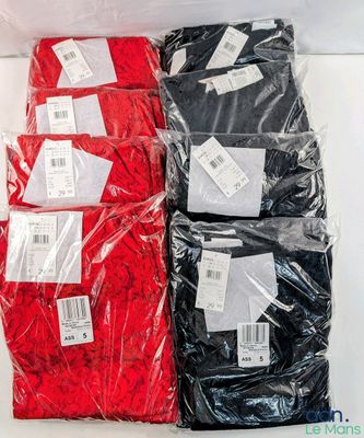 four pairs of red, black and white shirts in plastic bags