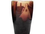 a glass with a picture of a man and a woman on it