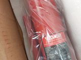 a red fire extinguisor in a cardboard box