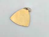 a gold plated triangle shaped pendant with a small hole in the middle