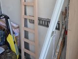 a ladder leaning up against a wall in a garage