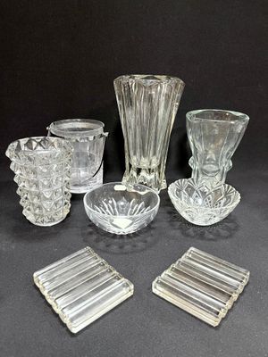 a lot of glass items that are sitting on a table