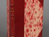 a red and white book with red spots on it