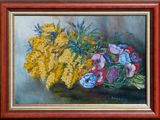 painting of a bouquet of flowers in a wooden frame on a table