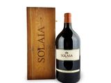 a bottle of wine sitting next to a wooden box