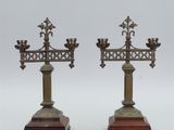 pair of antique brass candlesticks on wooden bases