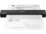 un scanner noir posé sur une feuille de papier