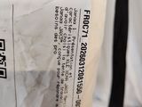 a close up of a bag with a label on it sitting on a table