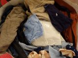 a suitcase full of clothes that is sitting on the floor