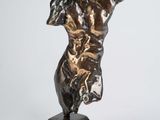 an image of a bronze statue of a woman on a pedestal
