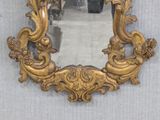 a mirror that is sitting on the wall