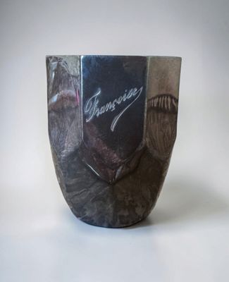 a vase with a picture of a man on it