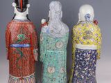 three chinese porcelain figurines of women in kimono robes