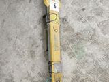 an image of a drill on the ground in a garage