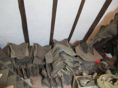 a pile of old books on the floor of a room