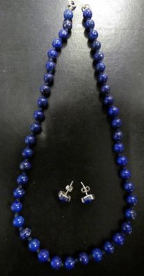 a necklace and earring set made of lapis beads